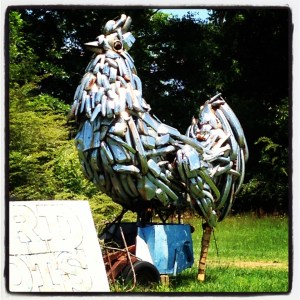 And then you go by the giant metal chicken...